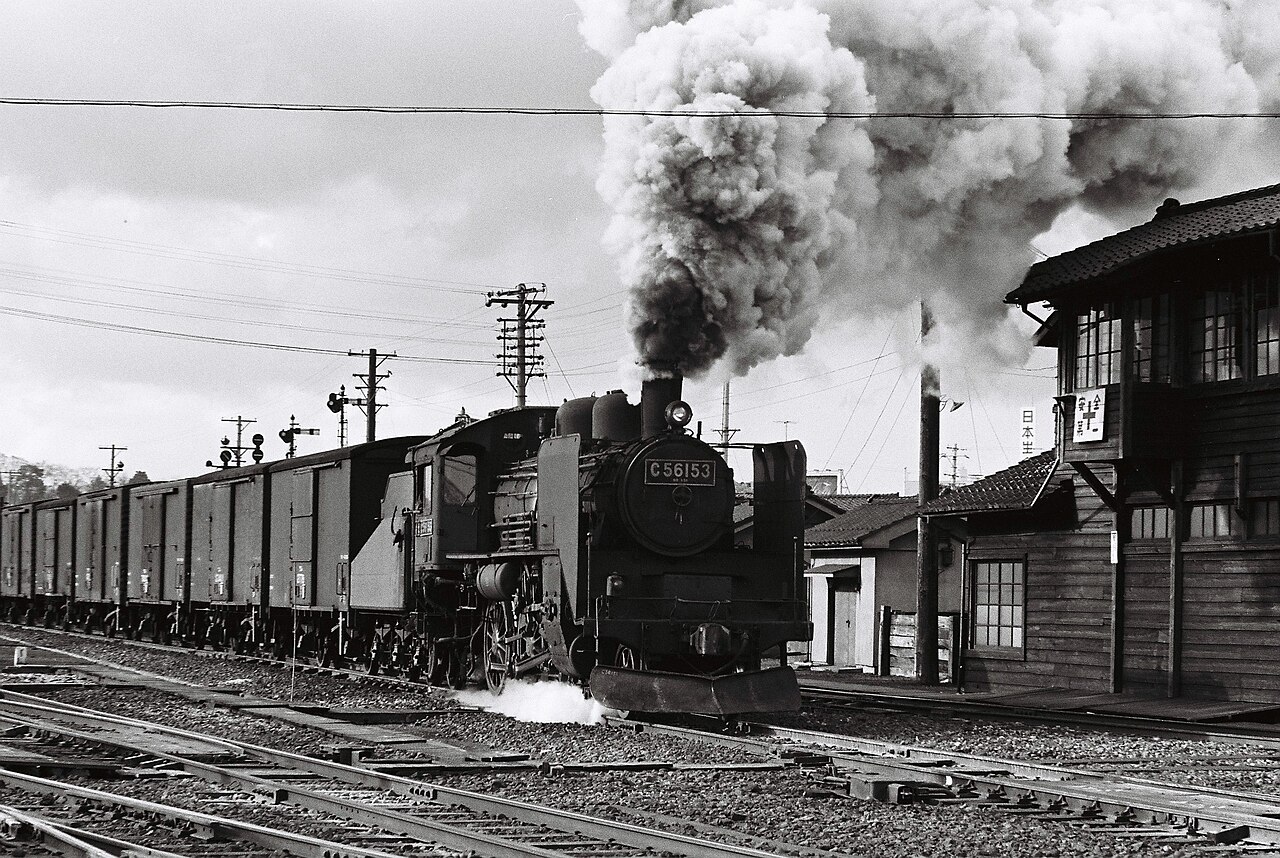 Steam locomotive pulling freight train