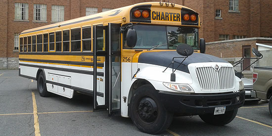 Photo of one of the school buses we chartered to run the service